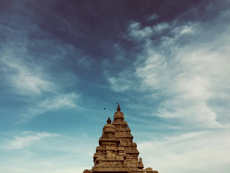 a very tall structure sitting under a blue sky