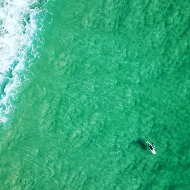 a view from the air over two people on their surf boards