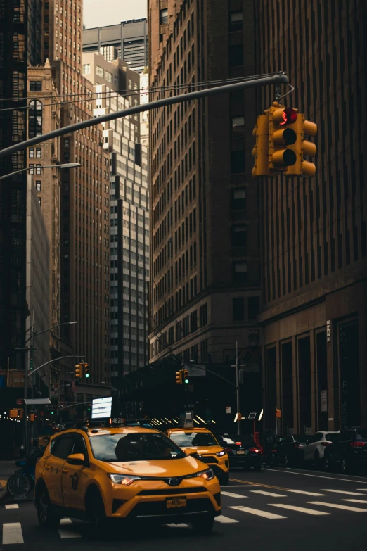 cars and traffic waiting at the intersection of a city street