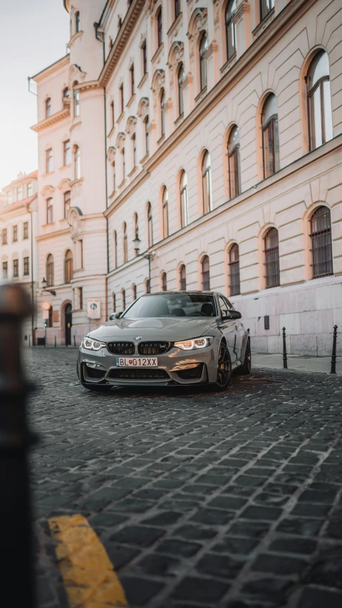 a car parked outside of a building in front of some steps