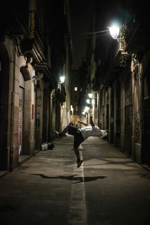 a man is doing tricks on his skateboard in the dark