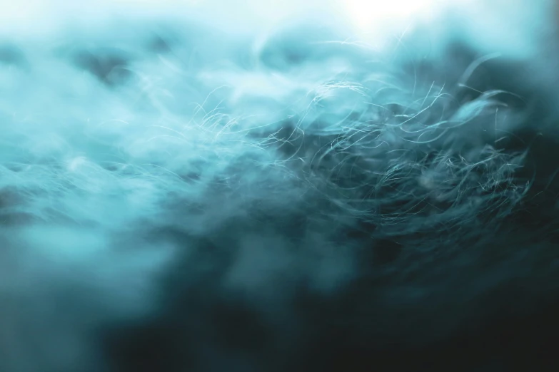 an abstract image with lots of blue smoke