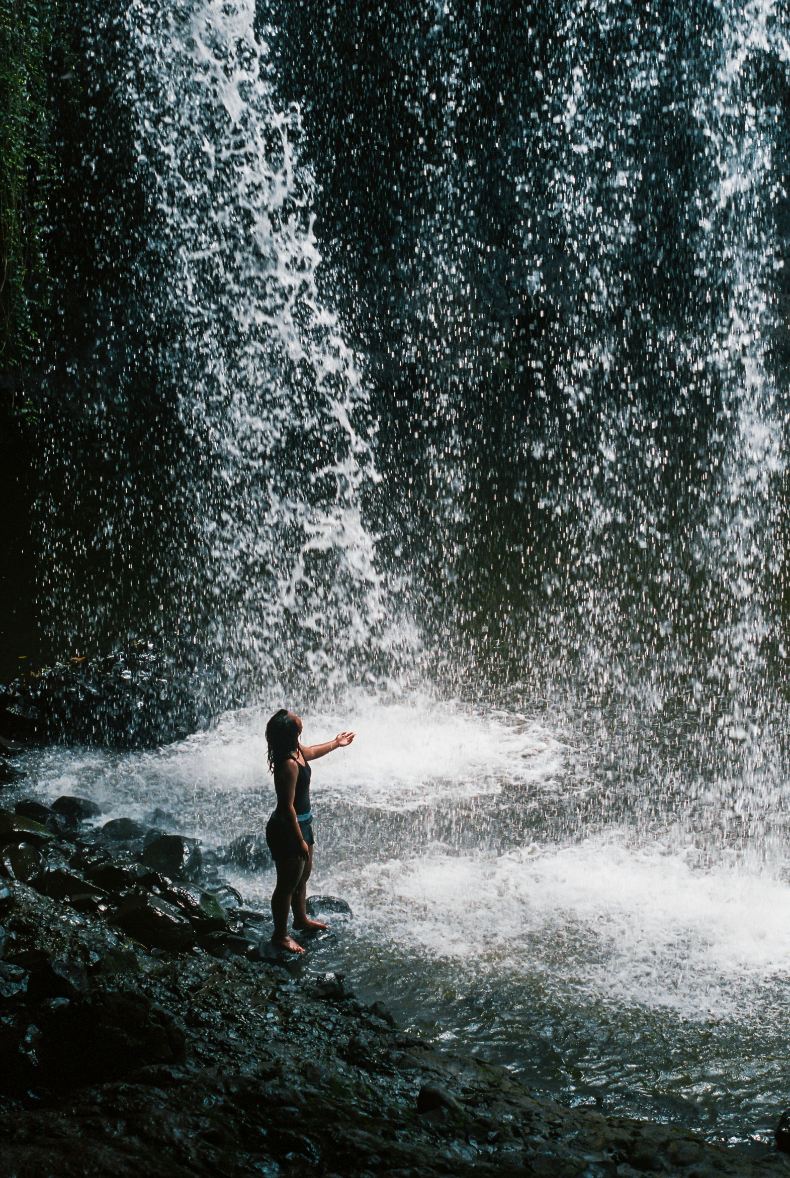 a little  playing in water with water spouts