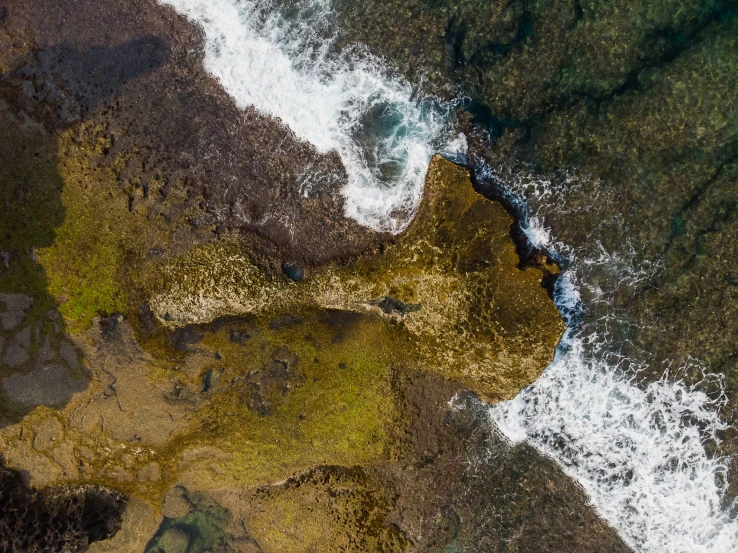 an aerial s of some water and rocks