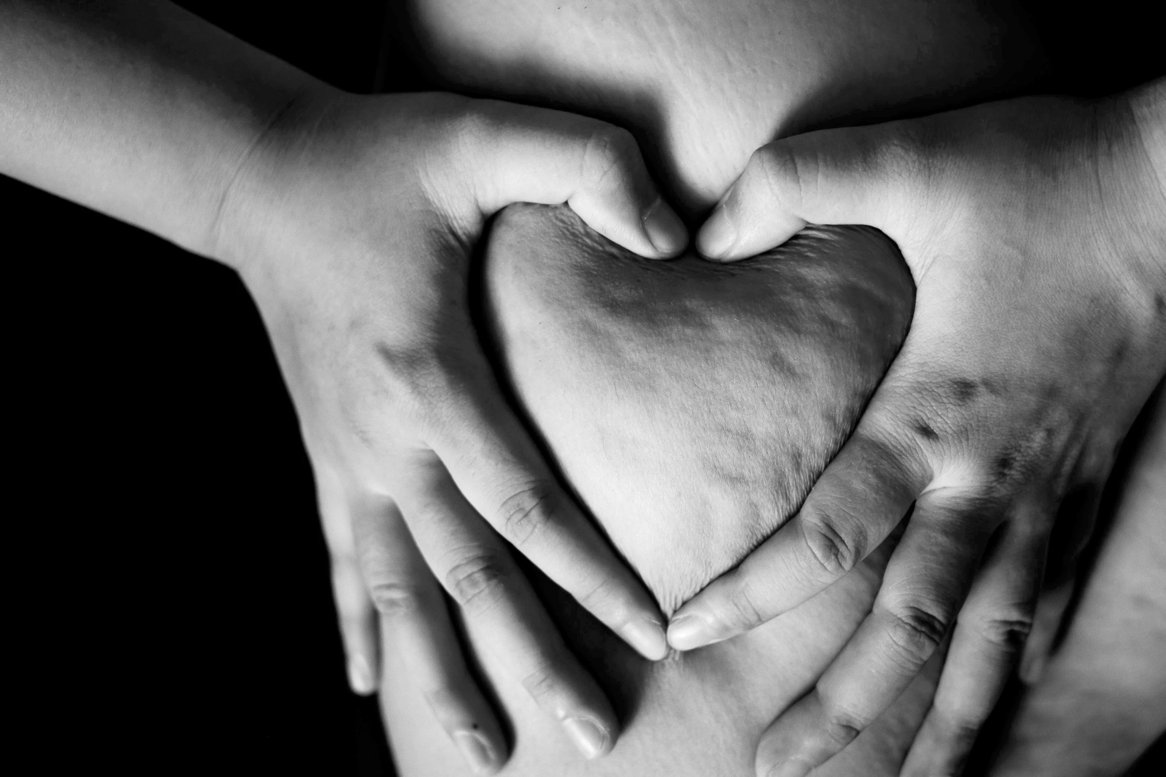 hands making a heart shape with their palms