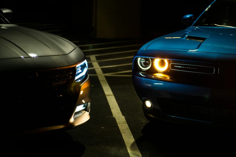 a pair of car's head lights on the front of their vehicle