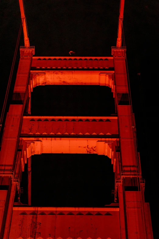 an upward image with a tall building that is lit up