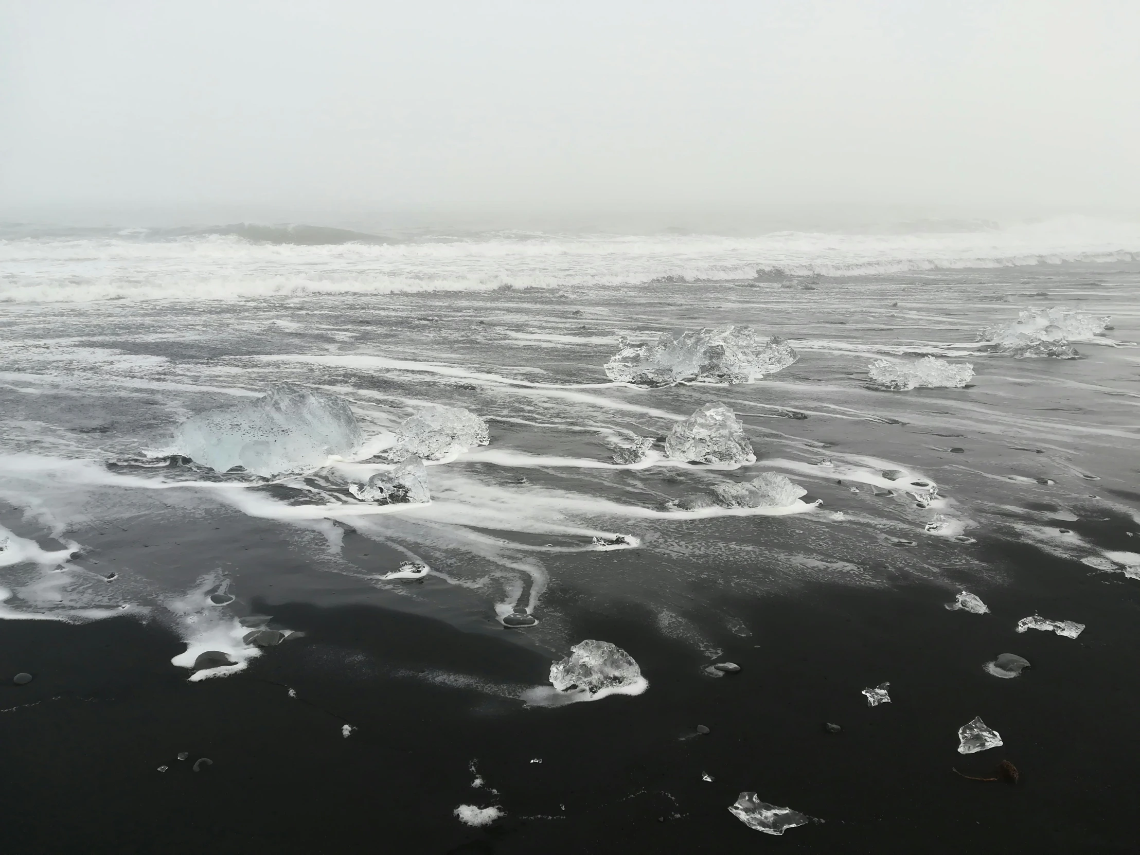 water and ice are in the cold on the beach