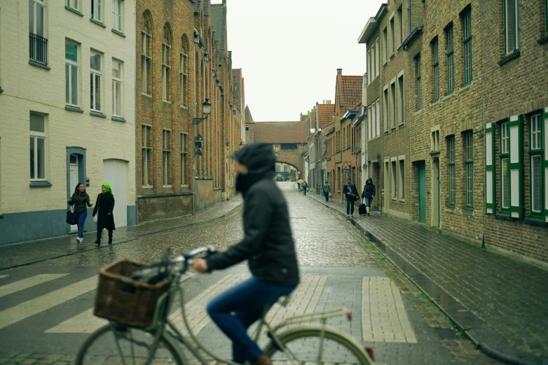 a man is riding a bike down the street