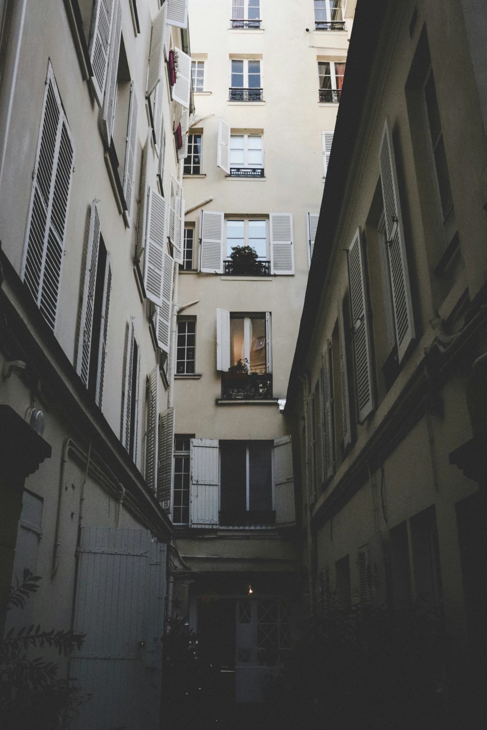 some buildings with a bunch of windows and a white wall