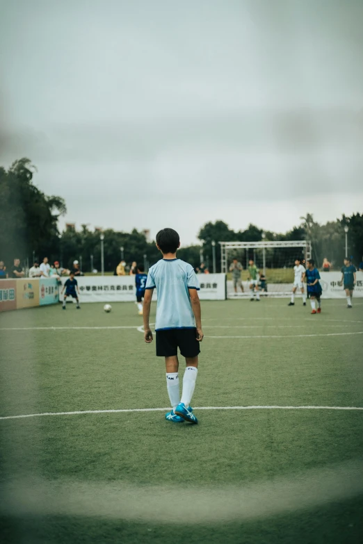 soccer players stand on the field with their ball