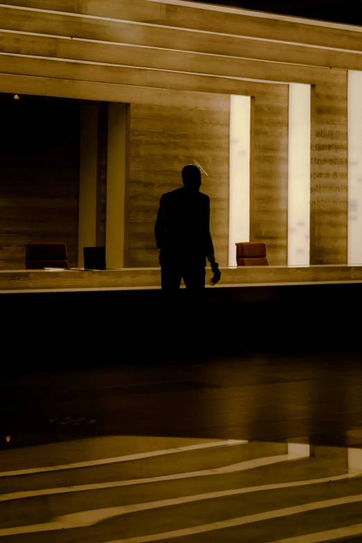 a person walking by some columns in an airport