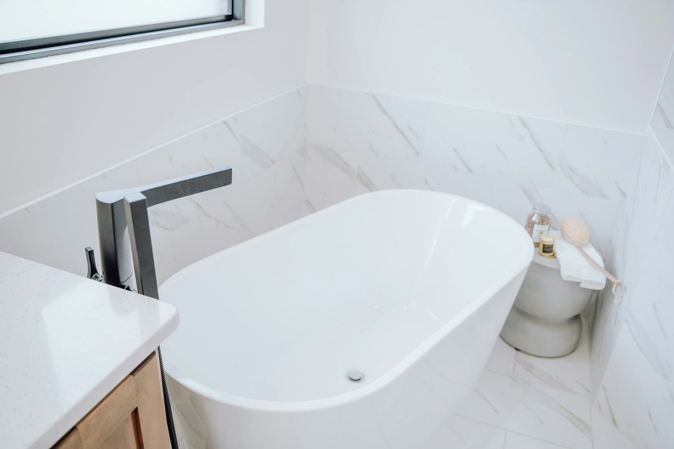 a white tub in the corner of a bathroom