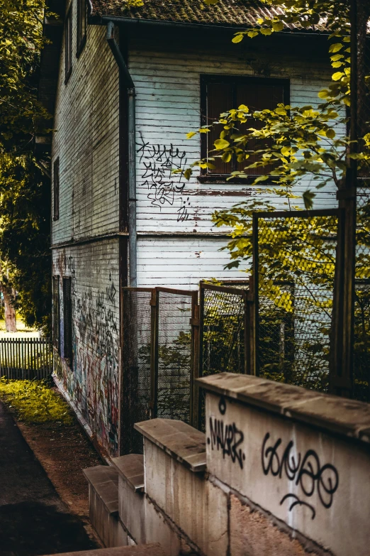 an old building with grafitti on the side