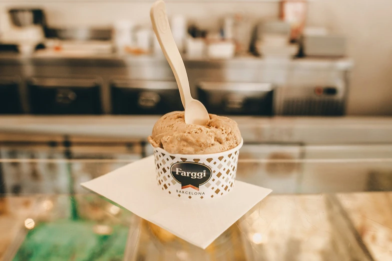 a scoop of ice cream is seen in the foreground