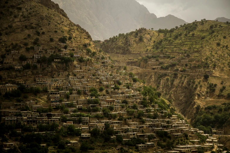 a group of buildings that are near some mountains