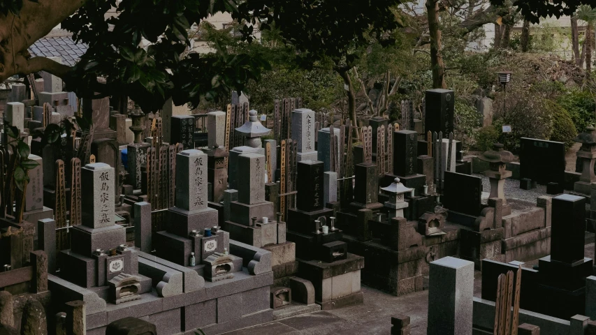 a cemetery filled with graves sitting on top of cement