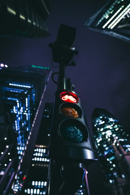 traffic light in front of the city lights