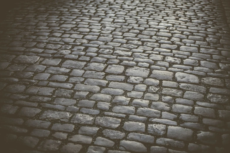 a road with cobblestones as the backdrop