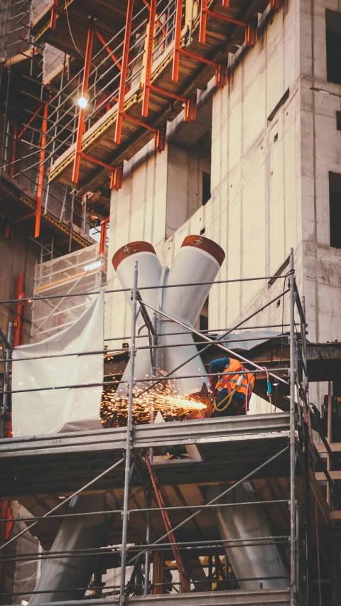 an overhead view of a large white structure under construction