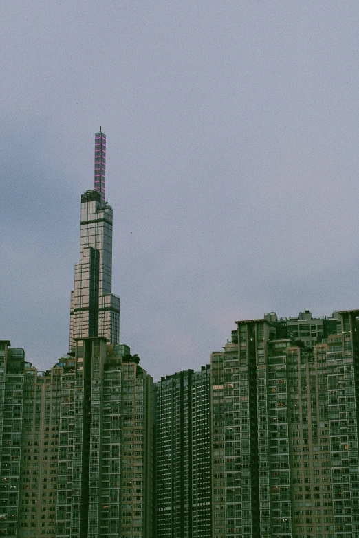 a view of some tall buildings from the ground