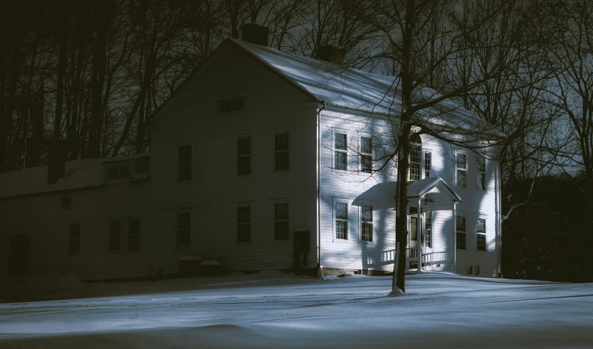 a large white house on the side of a road