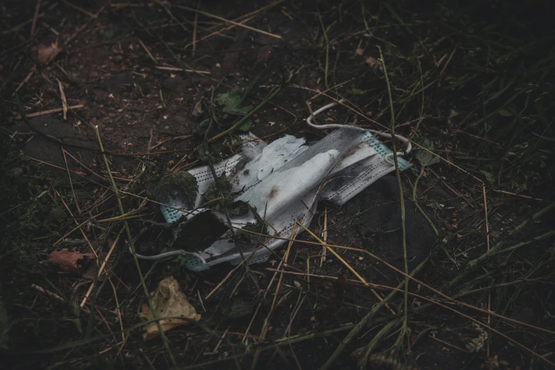 a white piece of cloth is laying in the grass