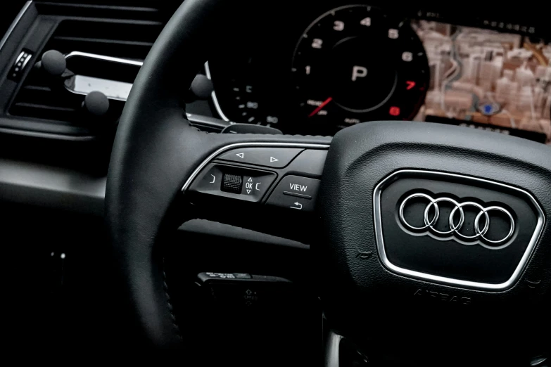 the interior of an automobile with its steering wheel visible