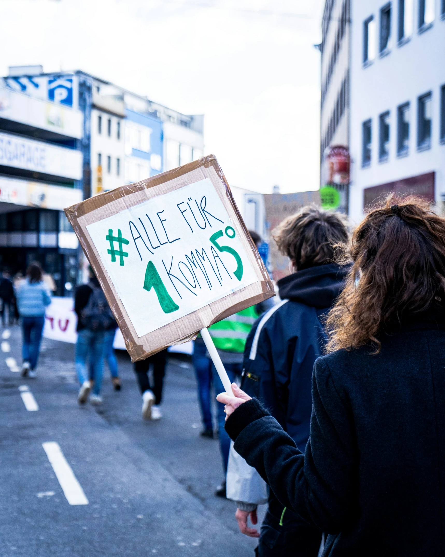 people walking down the street and holding signs that read'all flex for no one '