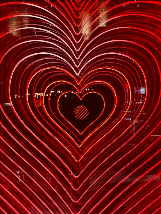 red neon light in a heart shape