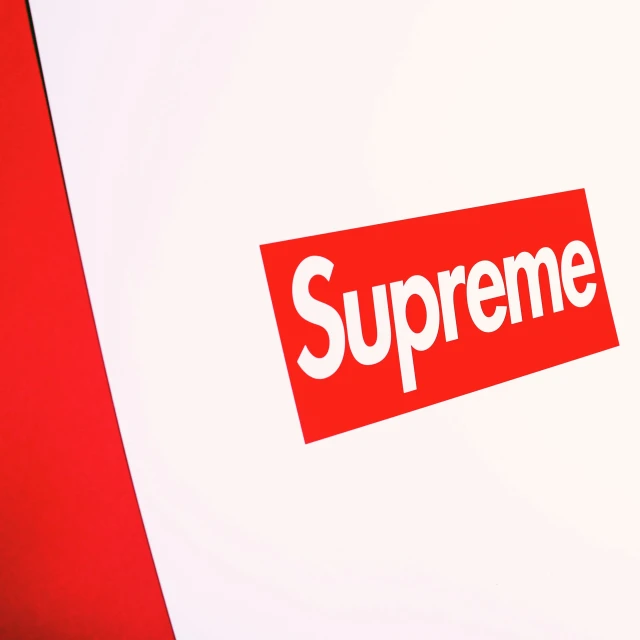 an image of an supreme sticker on the back of a box