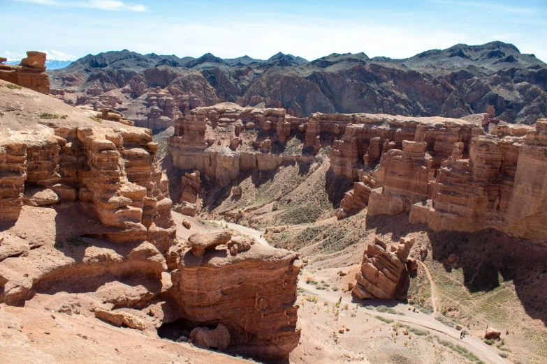 the view from atop a high cliff overlooking a canyon