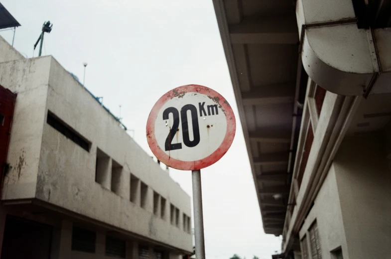 a close - up of the side of a building next to a speed limit sign