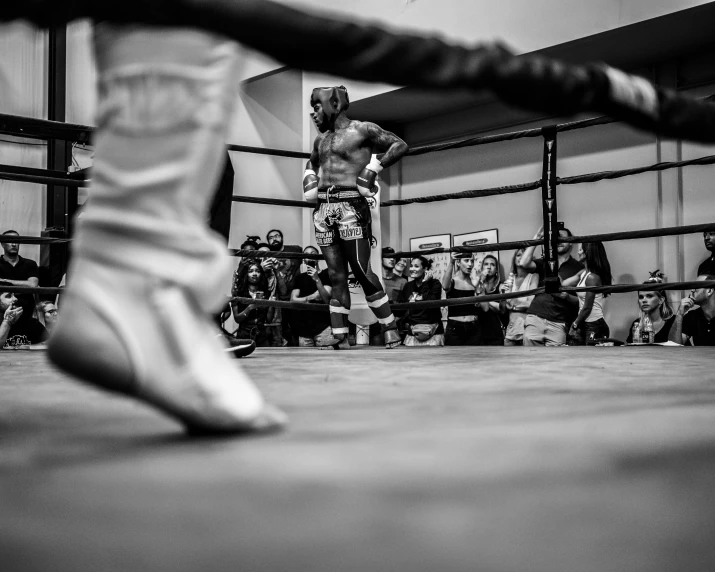 a man holding onto his boxing belt during a bout