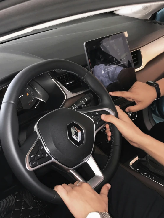 a person in a car with a laptop computer