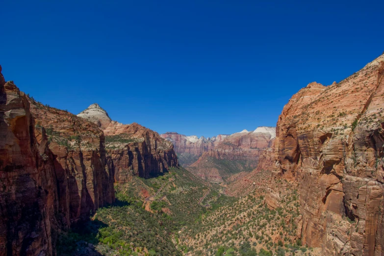 a scenic view of a river and mountains below