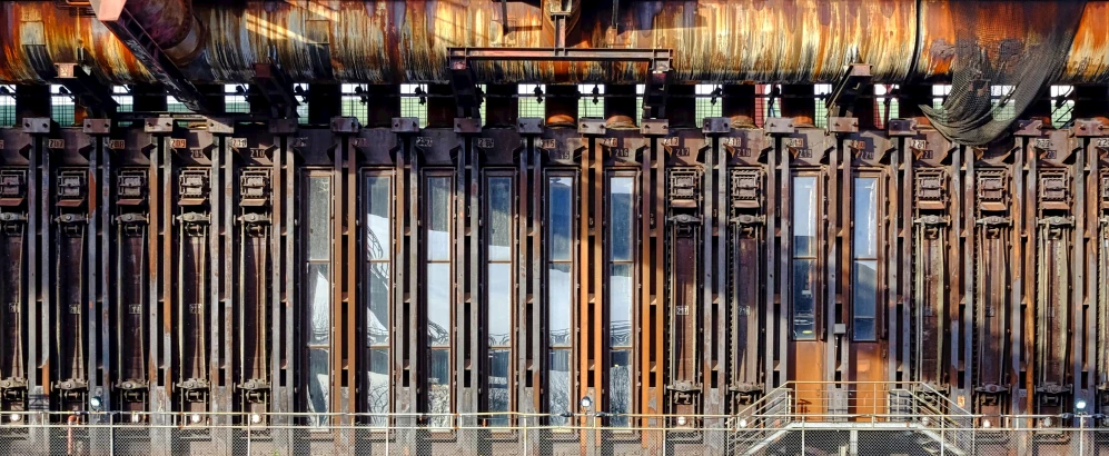 a metal structure with a fence near the ground