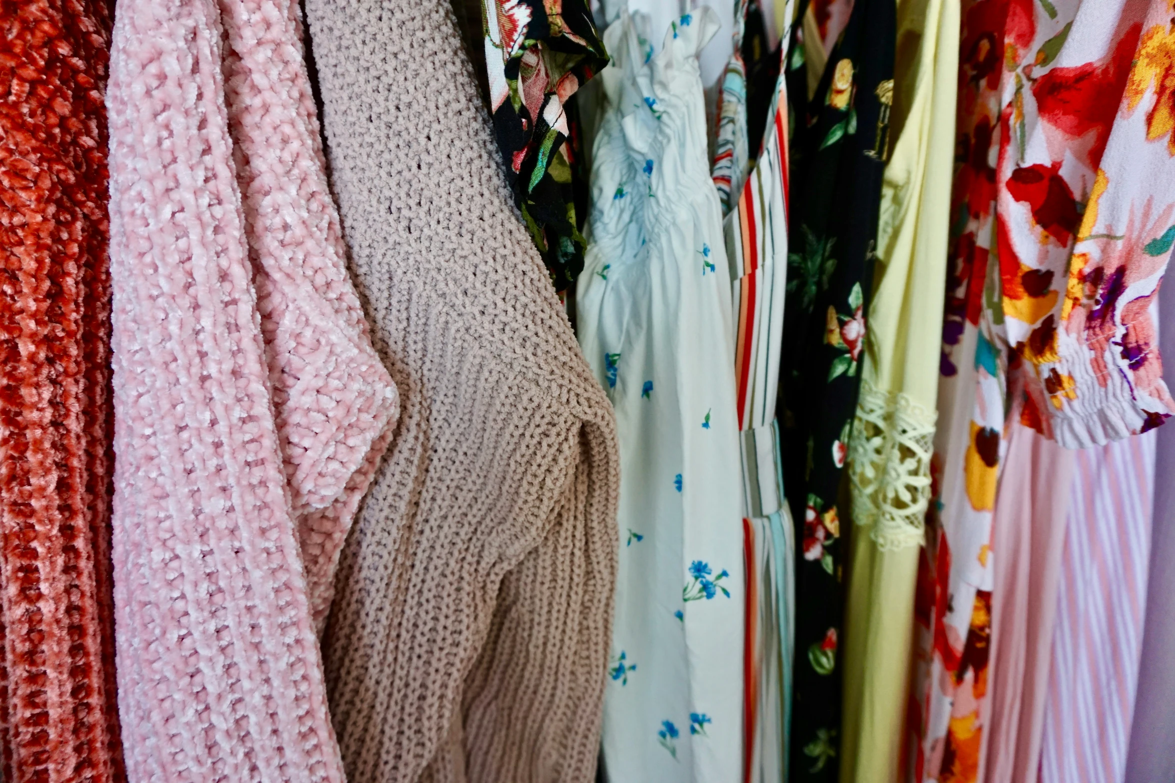 clothing is lined up with floral patterns on them