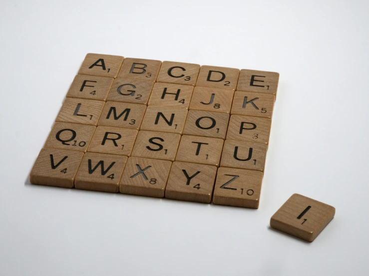 a tile type board that is decorated with letters