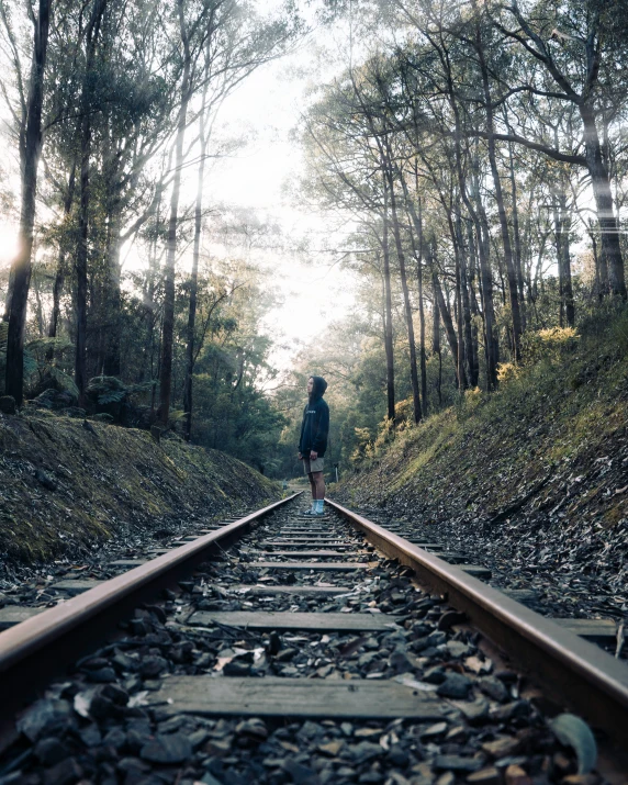 a man standing on the edge of a train track