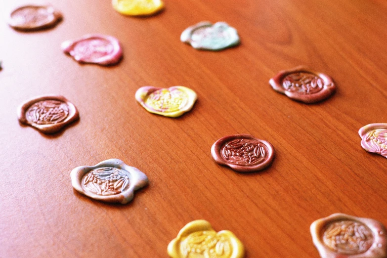 there are many different wax seal designs on this table