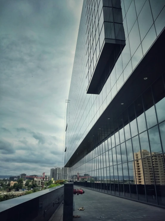 building in the city, reflecting sky and clouds