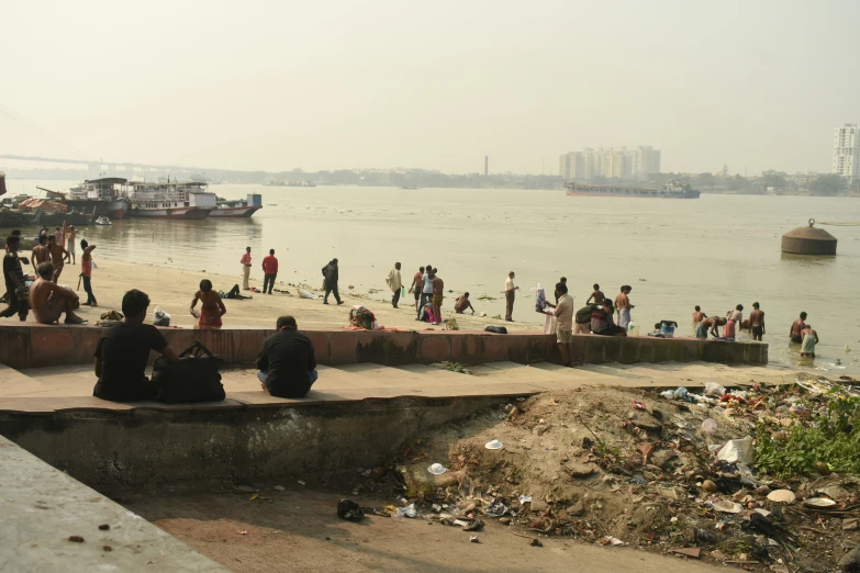 people near a dock on the water and boats