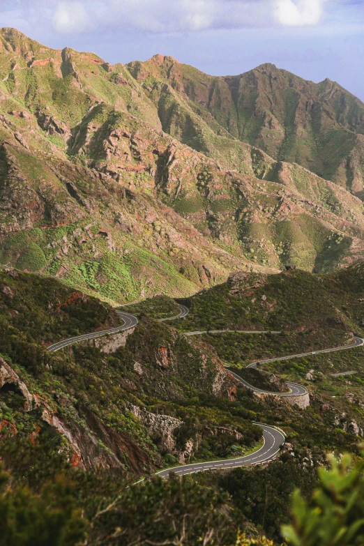 the view of some mountains and roads near one another