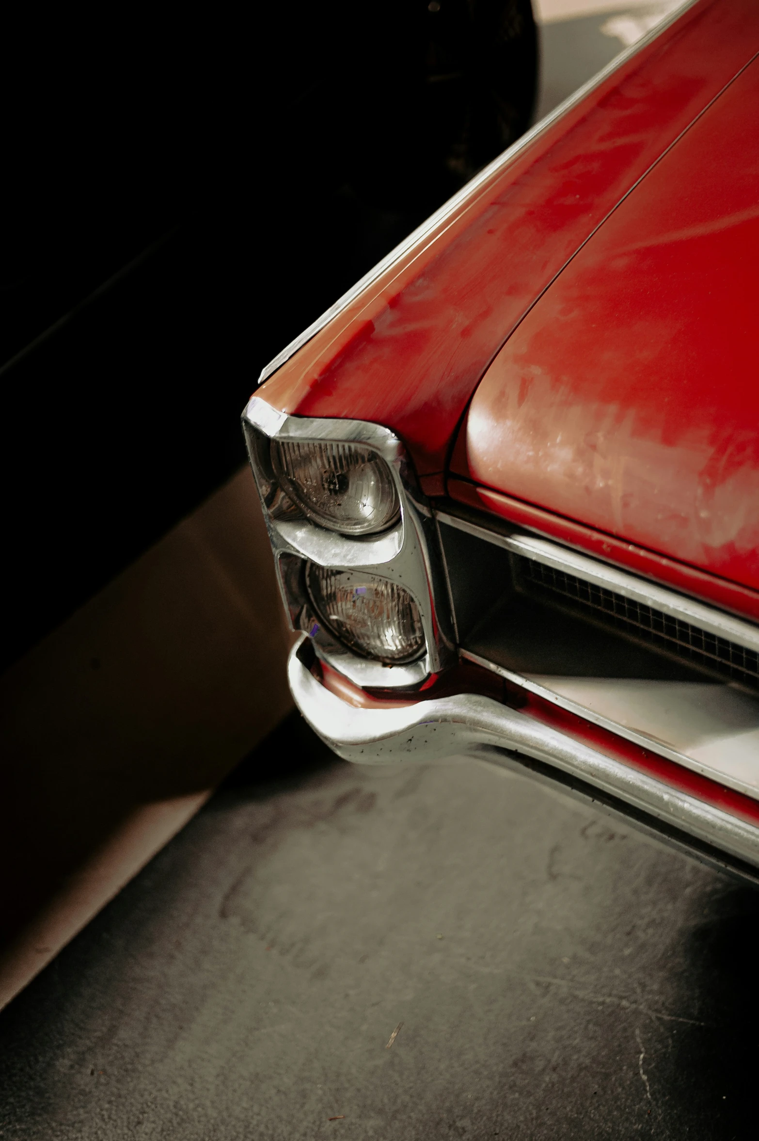 a close up of a car with a bright red hood