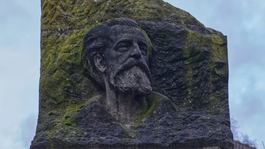 a large stone statue of jesus in the middle of nowhere