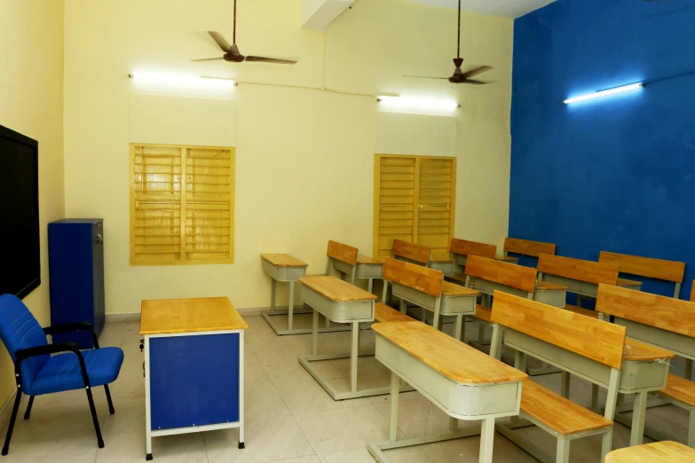 an empty classroom is set up with chairs