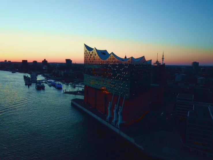 a city is shown at twilight in the water