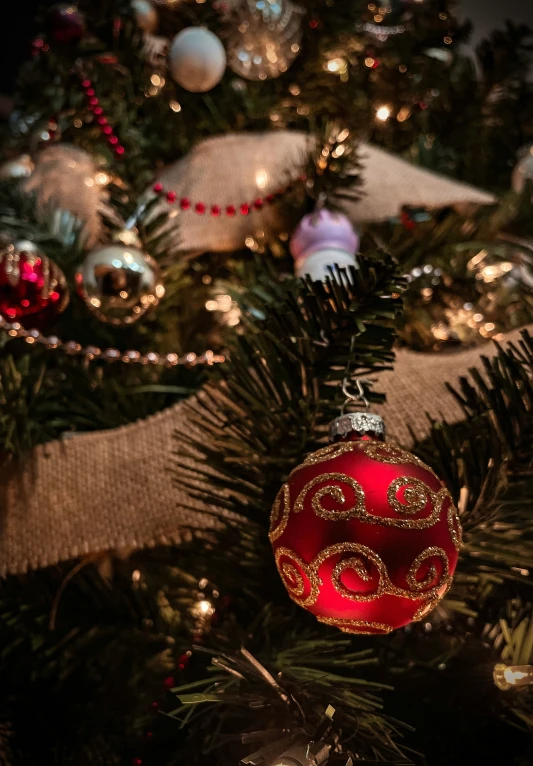 a close up of an ornament hanging on a christmas tree