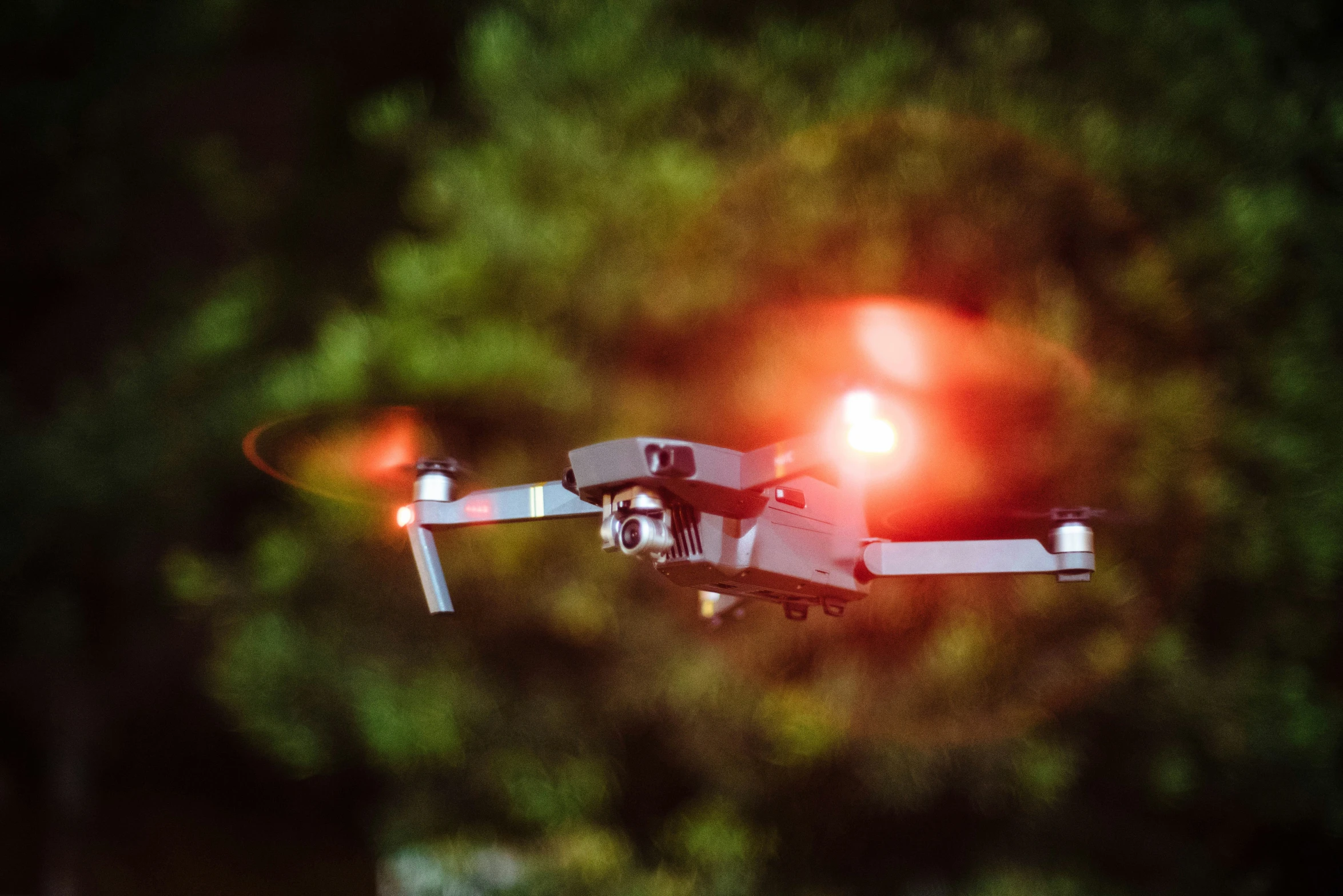 a flying camera with lens attached to the top